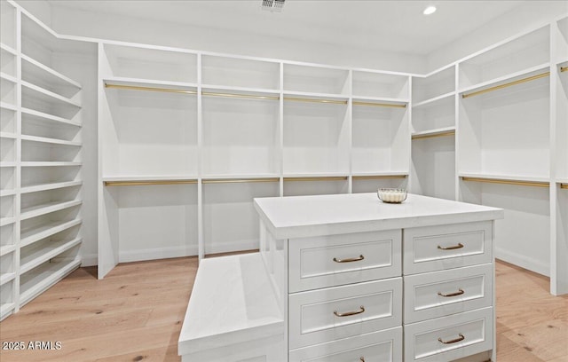 10755 E Cholla Ln, Scottsdale, AZ 85259 - walk in closet featuring light wood finished floors