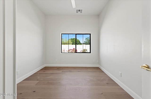 10755 E Cholla Ln, Scottsdale, AZ 85259 - unfurnished room with light wood-style flooring and baseboards