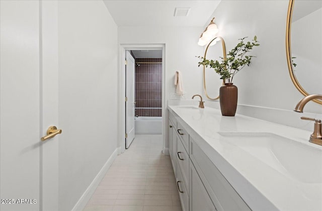 10755 E Cholla Ln, Scottsdale, AZ 85259 - full bath with double vanity, a bathtub, baseboards, and tile patterned floors