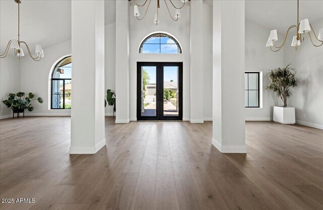 10755 E Cholla Ln, Scottsdale, AZ 85259 - foyer entrance featuring a chandelier, a high ceiling, wood finished floors, and baseboards