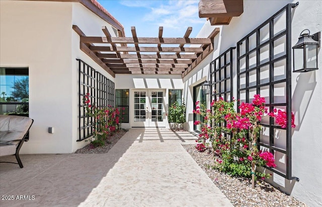 10755 E Cholla Ln, Scottsdale, AZ 85259 - doorway to property featuring french doors, stucco siding, and a pergola