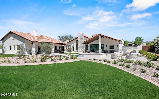 10755 E Cholla Ln, Scottsdale, AZ 85259 - rear view of house featuring a patio, a tiled roof, stucco siding, a chimney, and a lawn