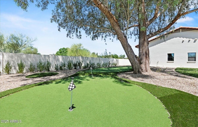 10755 E Cholla Ln, Scottsdale, AZ 85259 - view of community featuring a putting green and fence