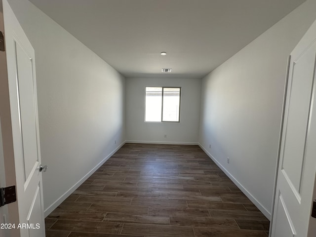 empty room featuring dark hardwood / wood-style floors