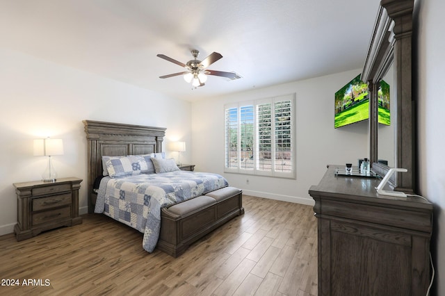 bedroom with hardwood / wood-style flooring and ceiling fan