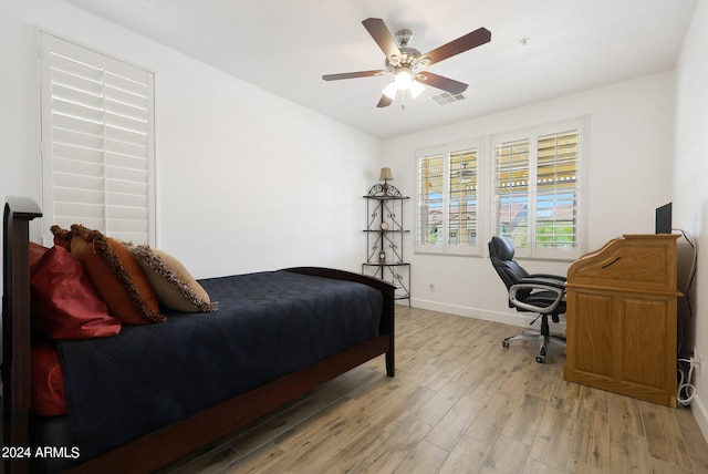 bedroom featuring ceiling fan and light hardwood / wood-style floors