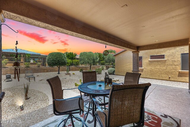 view of patio terrace at dusk