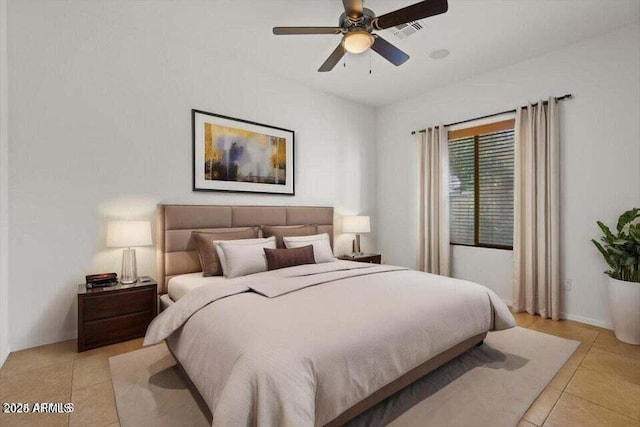 bedroom with ceiling fan and light tile patterned flooring