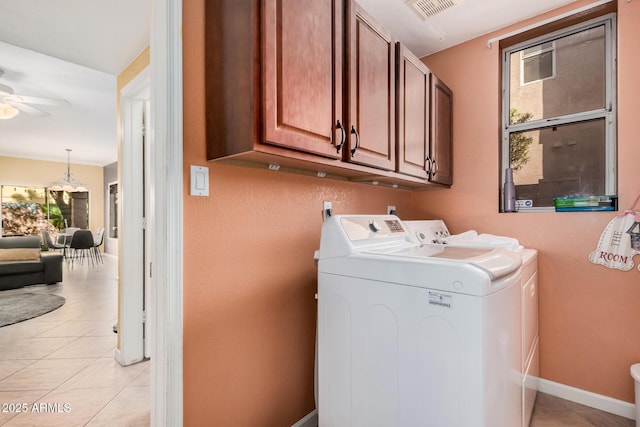 laundry area featuring visible vents, washer and clothes dryer, cabinet space, light tile patterned floors, and ceiling fan