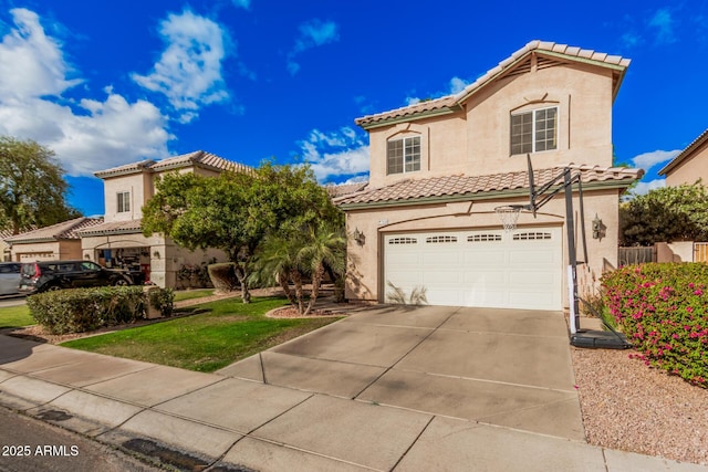 mediterranean / spanish home with a tiled roof, an attached garage, driveway, and stucco siding