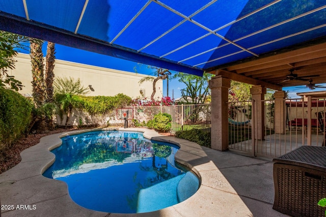 view of swimming pool featuring a ceiling fan, a patio area, a fenced backyard, and a fenced in pool