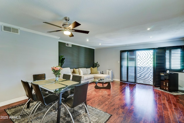 5122 E Shea Blvd Unit 1020, Scottsdale, AZ 85254 - dining area with visible vents, baseboards, wood finished floors, and ornamental molding
