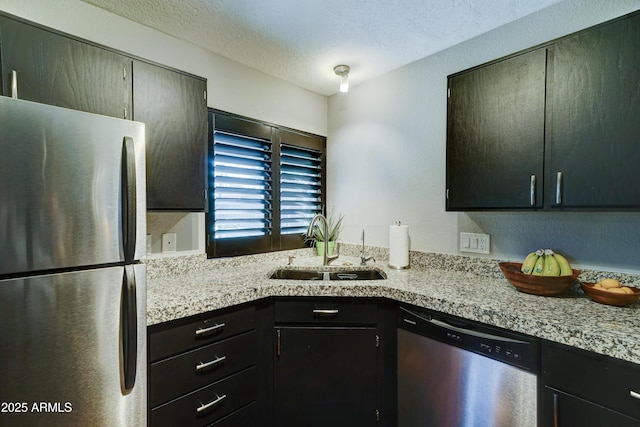 5122 E Shea Blvd Unit 1020, Scottsdale, AZ 85254 - kitchen with a sink, a textured ceiling, and stainless steel appliances