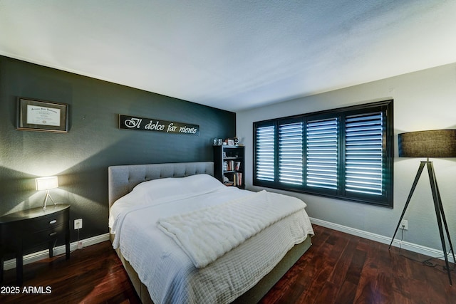 5122 E Shea Blvd Unit 1020, Scottsdale, AZ 85254 - bedroom featuring baseboards and wood finished floors