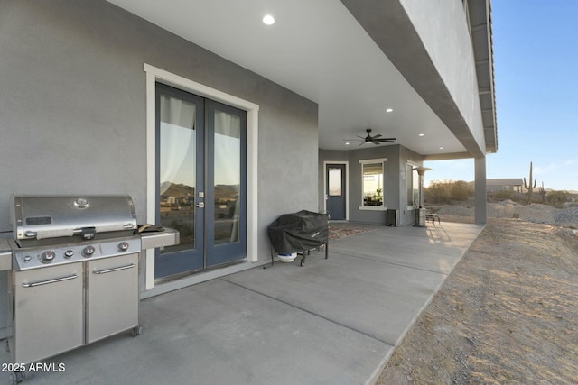 view of patio / terrace featuring french doors and a grill