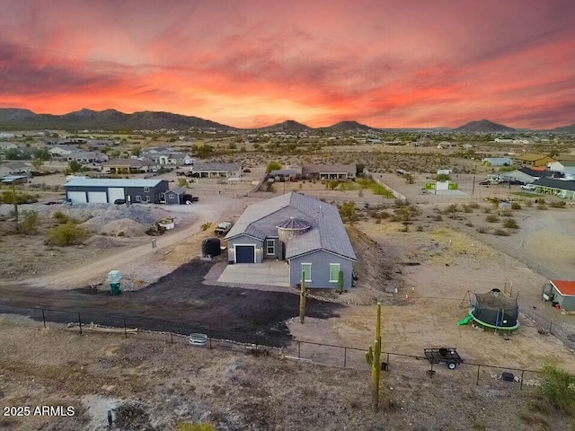 drone / aerial view featuring view of desert and a mountain view