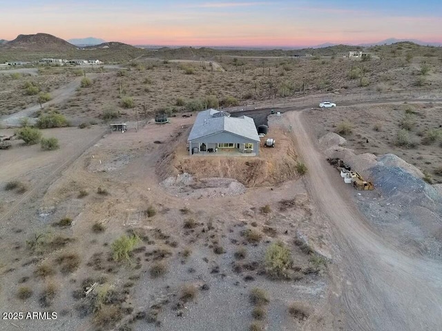 bird's eye view with a desert view and a mountain view