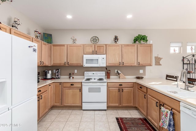 kitchen with light brown cabinets, white appliances, sink, and light tile patterned floors