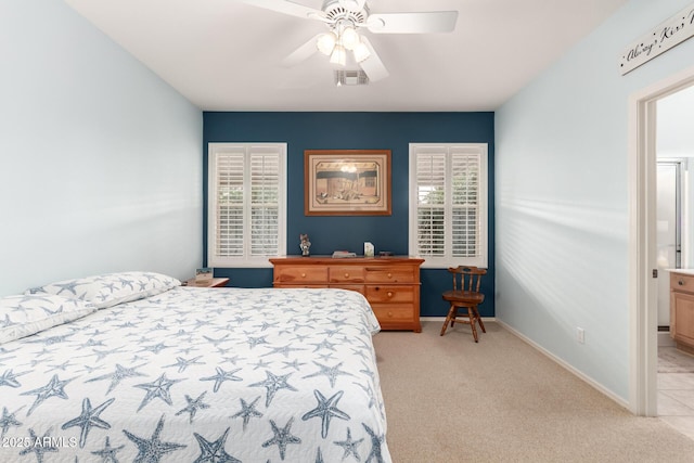 bedroom featuring ceiling fan and light colored carpet