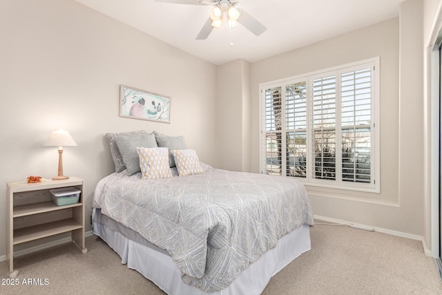 bedroom with light colored carpet and ceiling fan