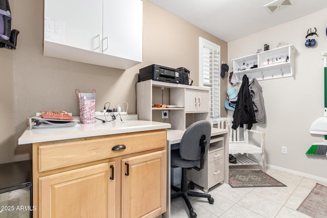 home office featuring light tile patterned flooring