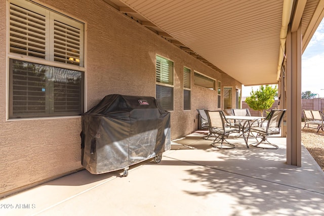 view of patio featuring a grill