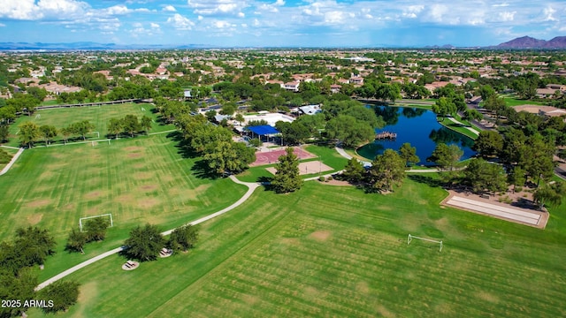 birds eye view of property featuring a water and mountain view