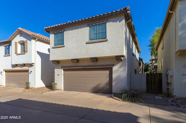 mediterranean / spanish-style home with a garage