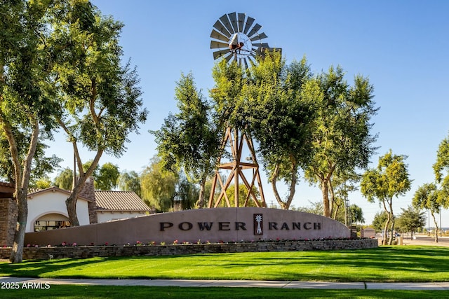 community / neighborhood sign with a lawn