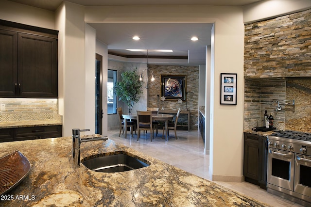 10205 E Happy Valley Rd, Scottsdale, AZ 85255 - kitchen featuring double oven range, a sink, backsplash, stone countertops, and recessed lighting