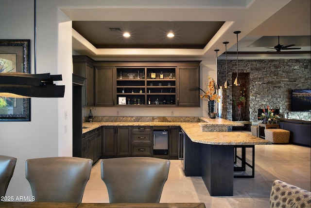 10205 E Happy Valley Rd, Scottsdale, AZ 85255 - bar area with a raised ceiling, ceiling fan, and hanging light fixtures