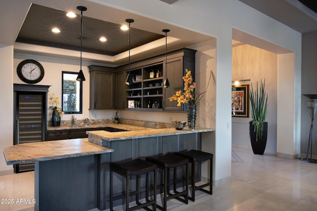 10205 E Happy Valley Rd, Scottsdale, AZ 85255 - indoor wet bar with a raised ceiling, baseboards, hanging light fixtures, wine cooler, and recessed lighting