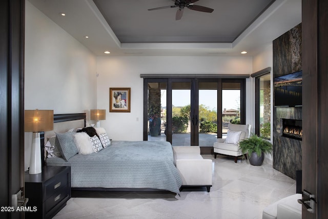 10205 E Happy Valley Rd, Scottsdale, AZ 85255 - bedroom with access to outside, french doors, a raised ceiling, a large fireplace, and recessed lighting