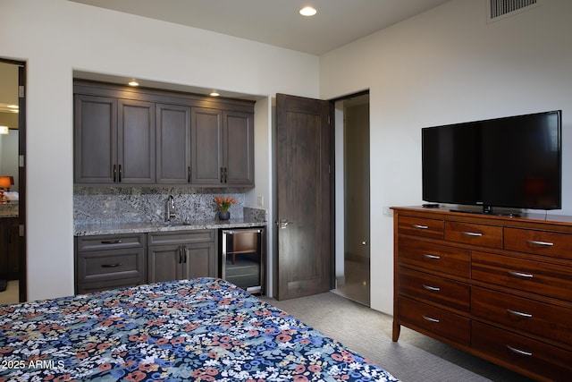 10205 E Happy Valley Rd, Scottsdale, AZ 85255 - bedroom featuring bar with sink, beverage cooler, light carpet, and recessed lighting