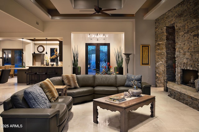 10205 E Happy Valley Rd, Scottsdale, AZ 85255 - living area with ceiling fan, a chandelier, and a stone fireplace