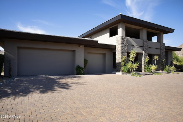 10205 E Happy Valley Rd, Scottsdale, AZ 85255 - view of front of property featuring stucco siding, a garage, and decorative driveway