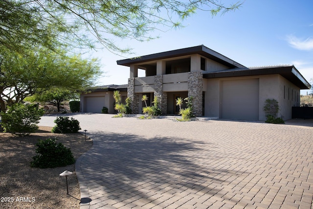 10205 E Happy Valley Rd, Scottsdale, AZ 85255 - contemporary home featuring a balcony, a garage, stucco siding, and decorative driveway