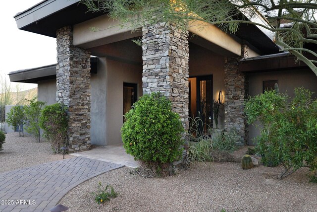 10205 E Happy Valley Rd, Scottsdale, AZ 85255 - view of property exterior with stucco siding and stone siding