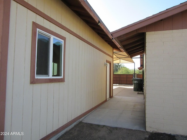 view of property exterior featuring a patio area