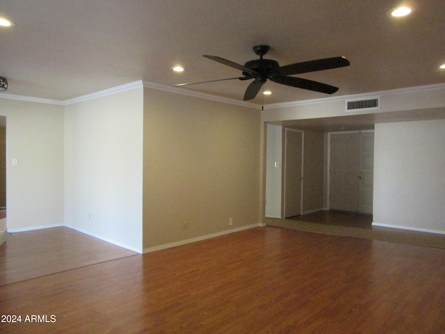 spare room with hardwood / wood-style flooring, ceiling fan, and ornamental molding