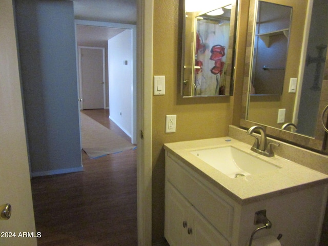 bathroom featuring vanity and wood-type flooring