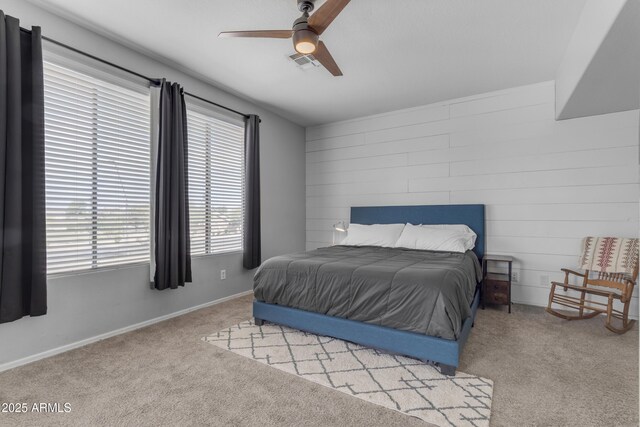 1405 S Honeysuckle Cir, Gilbert, AZ 85296 - bedroom with light colored carpet, ceiling fan, wooden walls, and baseboards