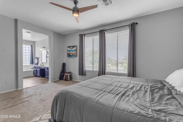 1405 S Honeysuckle Cir, Gilbert, AZ 85296 - bedroom featuring carpet flooring, connected bathroom, baseboards, and a ceiling fan