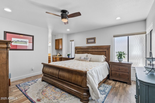 bedroom featuring baseboards, recessed lighting, wood finished floors, and ceiling fan