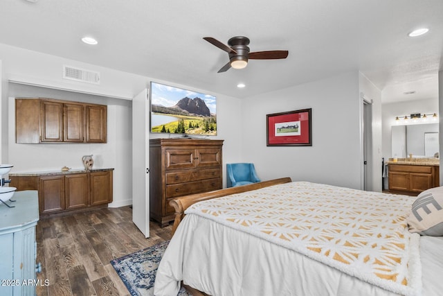 bedroom featuring recessed lighting, a sink, ceiling fan, dark wood-type flooring, and visible vents