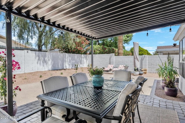 view of patio featuring outdoor dining area and a fenced backyard