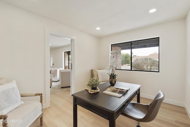 home office featuring recessed lighting, light wood-type flooring, and baseboards