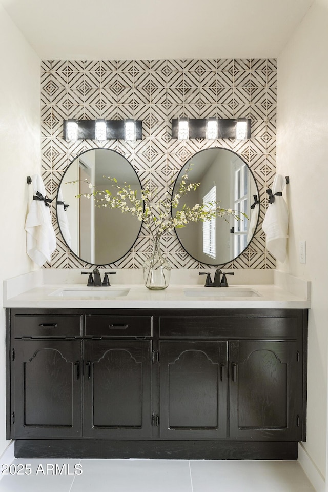 bathroom with a sink and double vanity