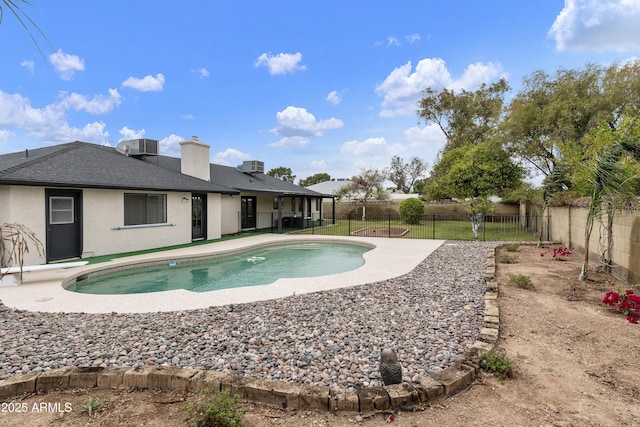 view of swimming pool with a fenced in pool, central AC, a fenced backyard, and a patio area