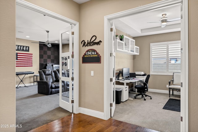 office space with ceiling fan and carpet floors